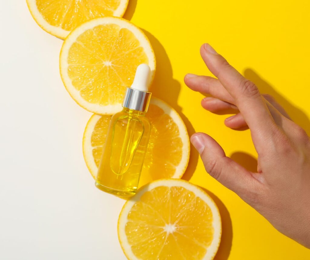 Skincare Trends for Your 30s and Beyond – Vitamin C serum with fresh orange slices, highlighting its glow-boosting benefits.