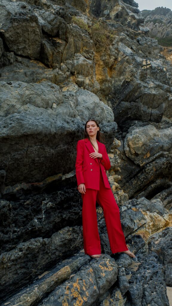 woman in red suit posing for a photoshoot