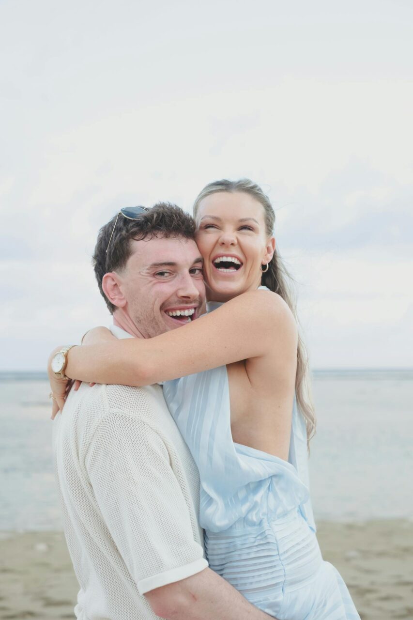 Image of a happy couple enjoying their moments at seaside with a cool weather, showing how can I be independent in a relationship.